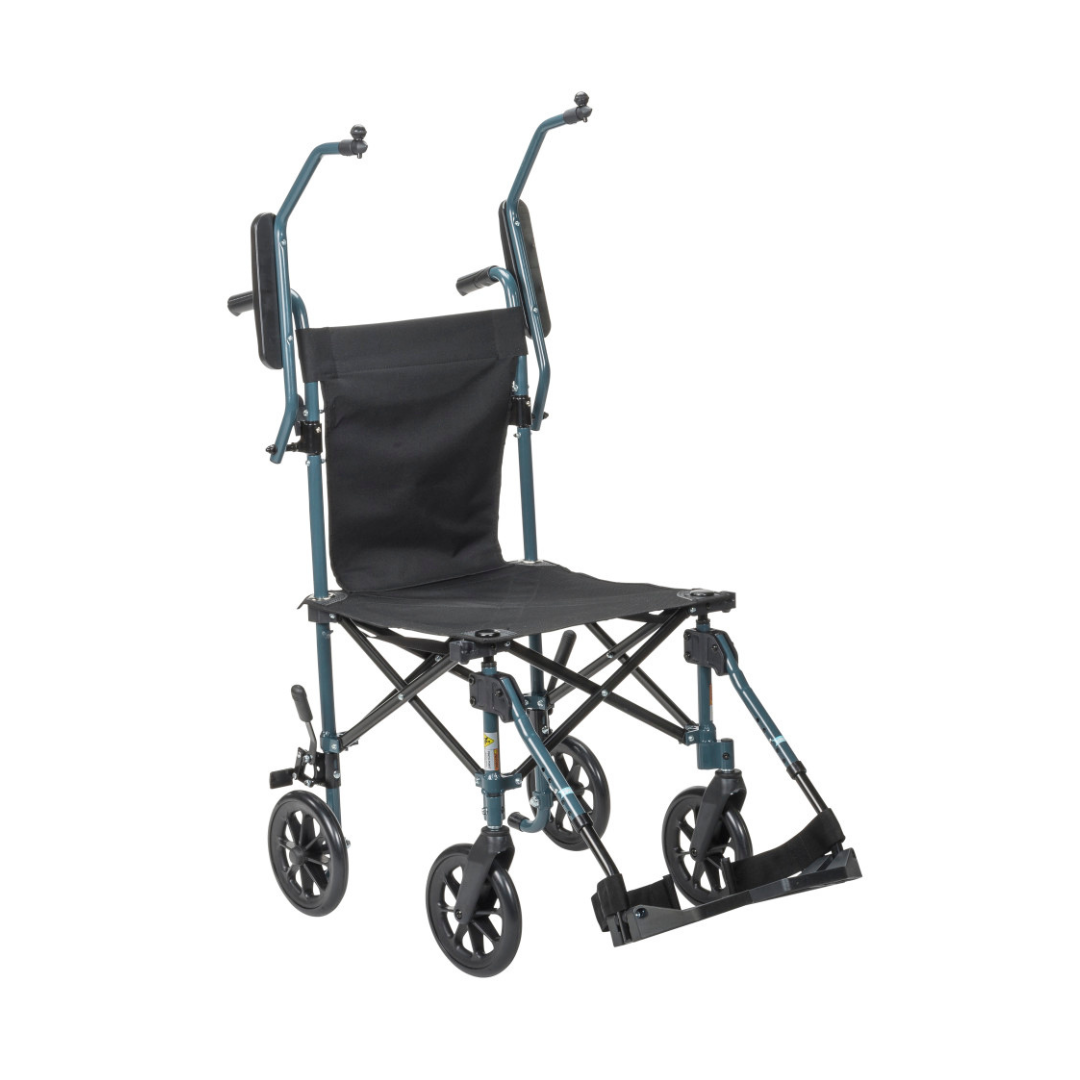 The Drive Travelite Transport Chair is ultra-compact, featuring a black seat, armrests, footrests, four small wheels, and folds easily for travel. It includes a rolling travel bag for convenient portability and storage.