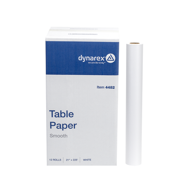 A white and blue Dynarex Exam Table Paper box with 12 rolls (21" x 225' each) stands beside a single roll, providing a protective barrier for exam tables.