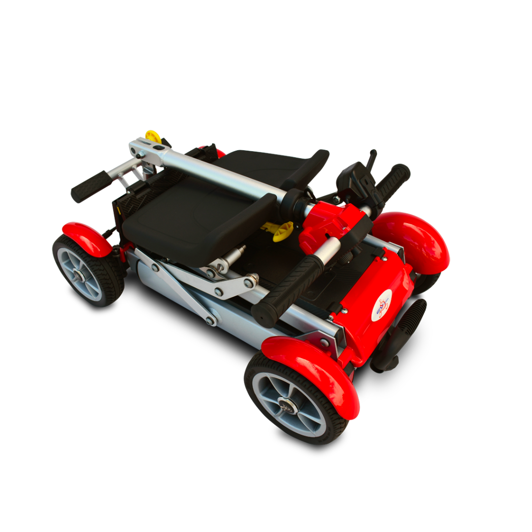 The EV Rider Gypsy Ultra Compact Airline Approved Scooter in red is shown folded for transport, displaying its four wheels, handlebars, and metal frame against a white background.