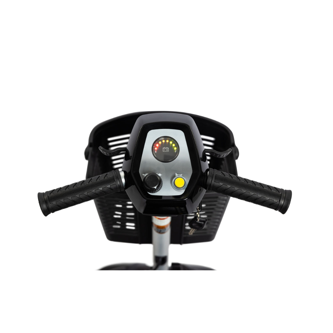 Close-up of the EV Rider Nomad Portable Mobility Scooter's handlebars and control panel, featuring textured grips, indicator lights, buttons, and a display, with a black basket visible in the background.