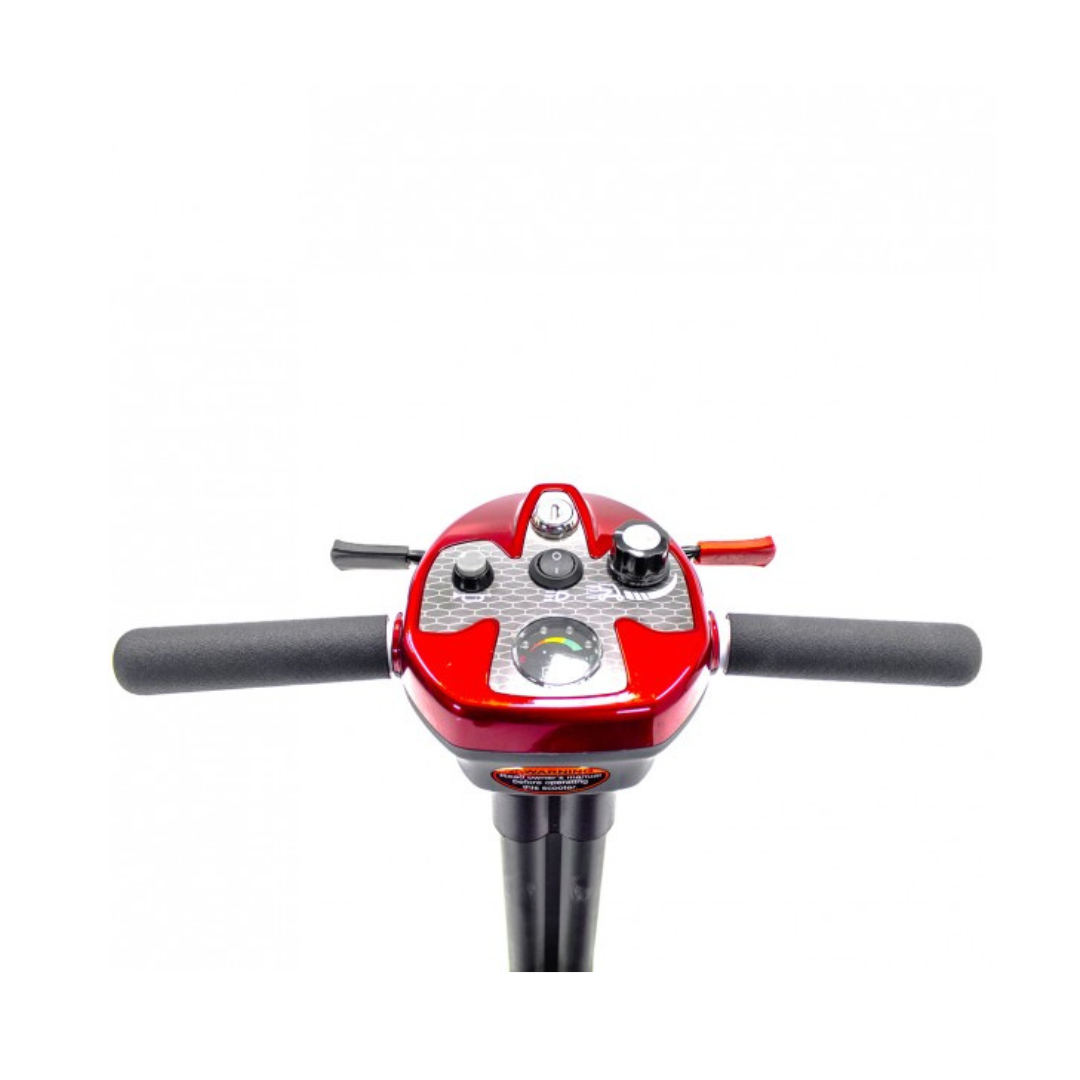 Close-up of the EV Rider TranSport S19AF Automatic Folding Travel Scooter control panel and handlebars, showing its red casing, various switches, buttons, and speed dial against a white background.