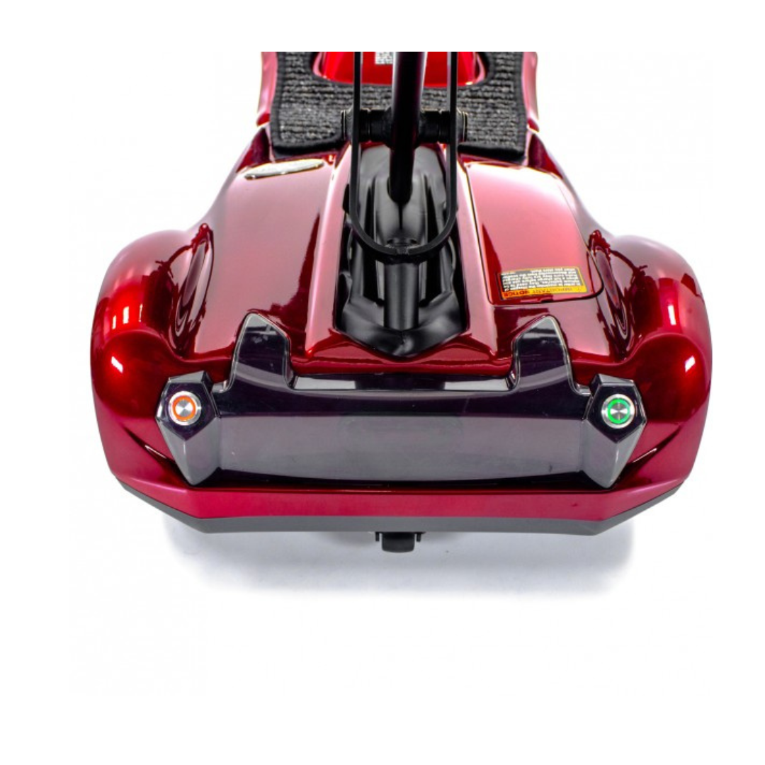 A close-up top-down view of the EV Rider TranSport S19AF Automatic Folding Travel Scooter’s rear shows two rear lights and a black bumper on its shiny red frame, all set against a white background.