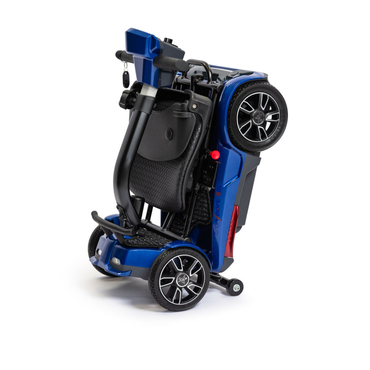 The EV Rider Transport 4M Travel Scooter is a compact, blue, airline-approved scooter that folds upright for easy transport or storage, with wheels and seat collapsed neatly together.