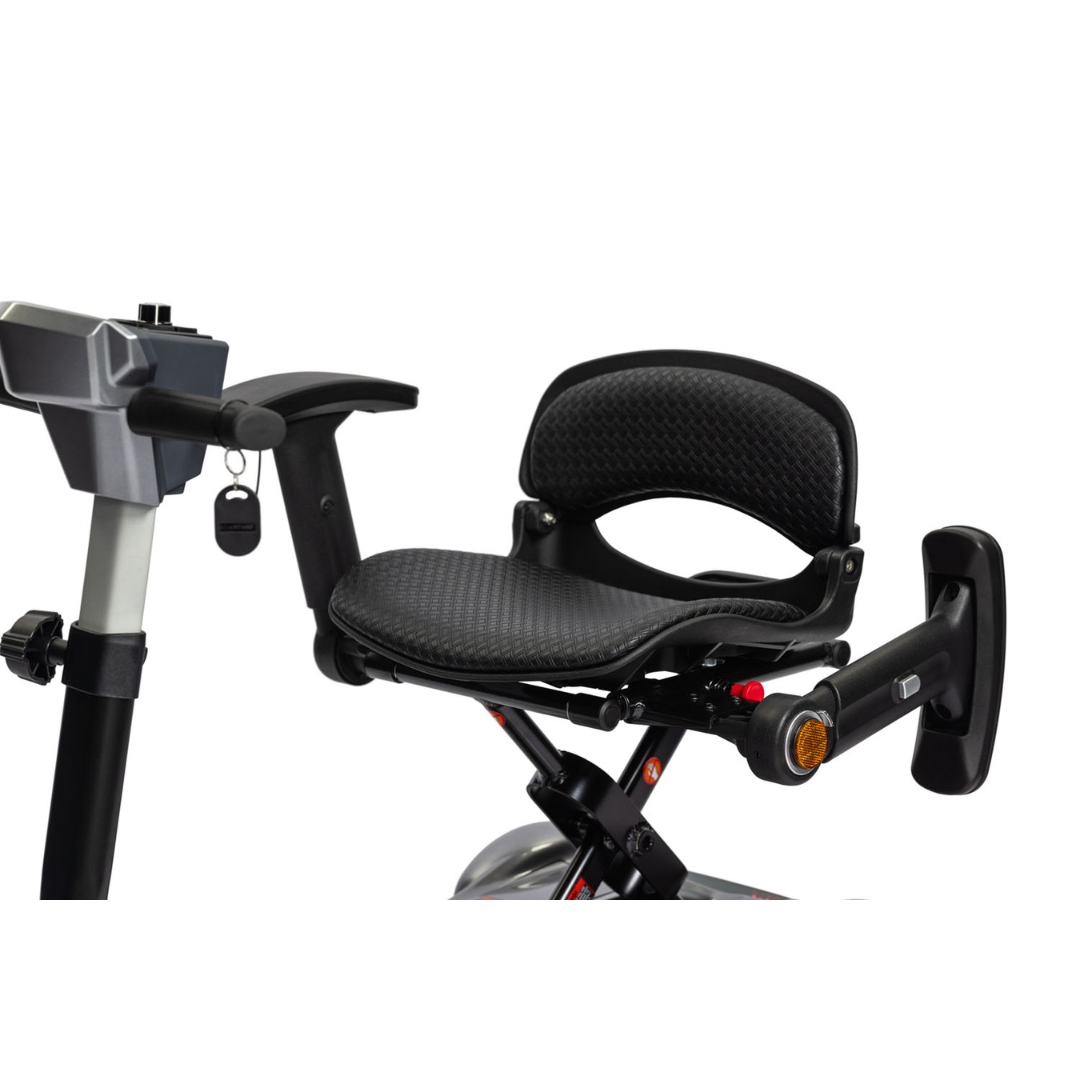 Close-up of the ergonomic, adjustable black padded seat with armrests and backrest on the EV Rider Transport 4M Travel Scooter, showing control buttons and key ignition on the side. The lightweight scooter offers comfortable and secure seating.
