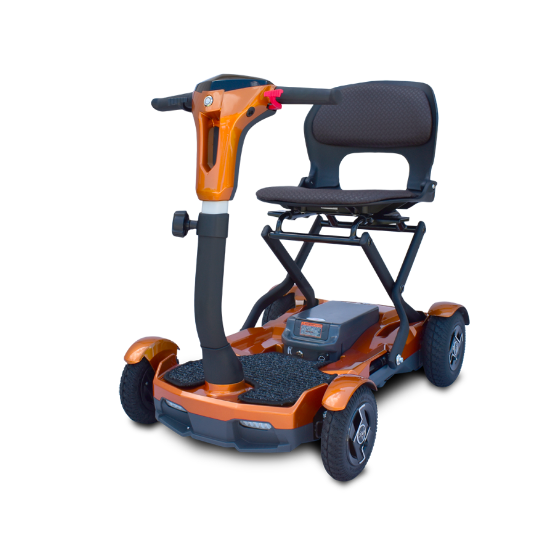 The EV Rider Teqno Automatic Folding Portable Travel Scooter is a compact orange four-wheel scooter with a cushioned black seat, armrests, handlebars, and footrest, shown on a plain white background.