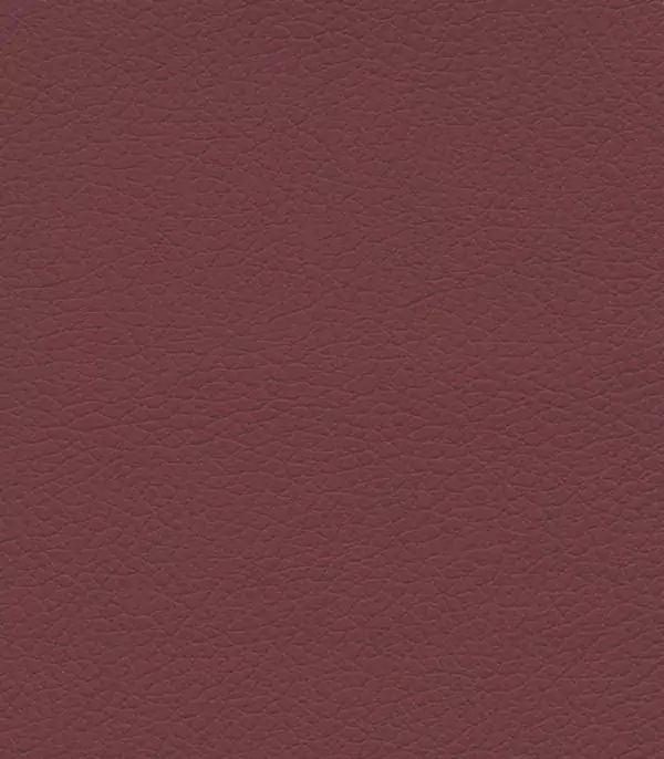 Close-up of a textured surface in deep burgundy, resembling leather with subtle grain patterns, similar to those on the Golden Tech PR766 Relaxer MaxiComfort Recliner With Lift Assist - Small, giving it an inviting and realistic look.