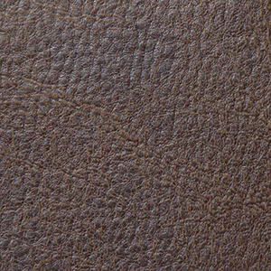 Close-up of the textured brown leather surface on the Golden Tech PR527 Cloud Recliner With Lift Assist & Twilight - SM/MD, highlighting natural creases and grain patterns found in genuine luxury leather upholstery.