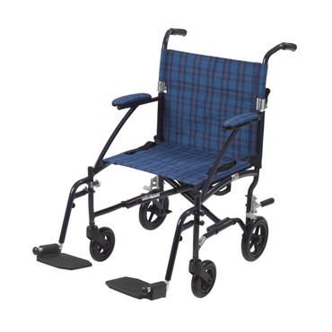 The Drive Fly-Lite Aluminum Transport Chair features a blue and black plaid seat and backrest, black armrests and footrests, small black wheels, and an ultra-lightweight aluminum frame for easy transport.