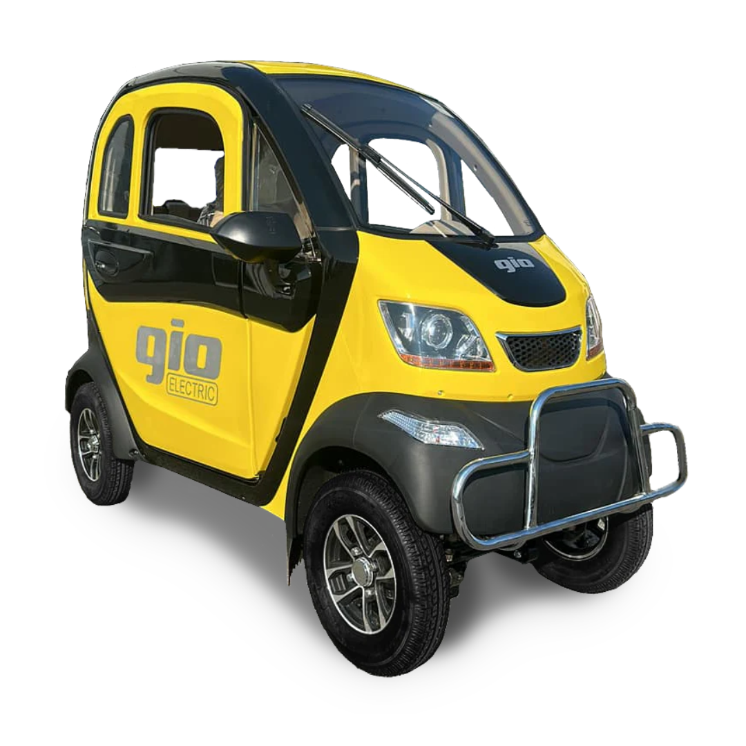 The GIO Golf, a yellow and black compact electric vehicle, has sporty elements and a front bumper guard, resembling an enclosed scooter. It features two doors and stands out against a white background, blending practical elegance with modern flair.
