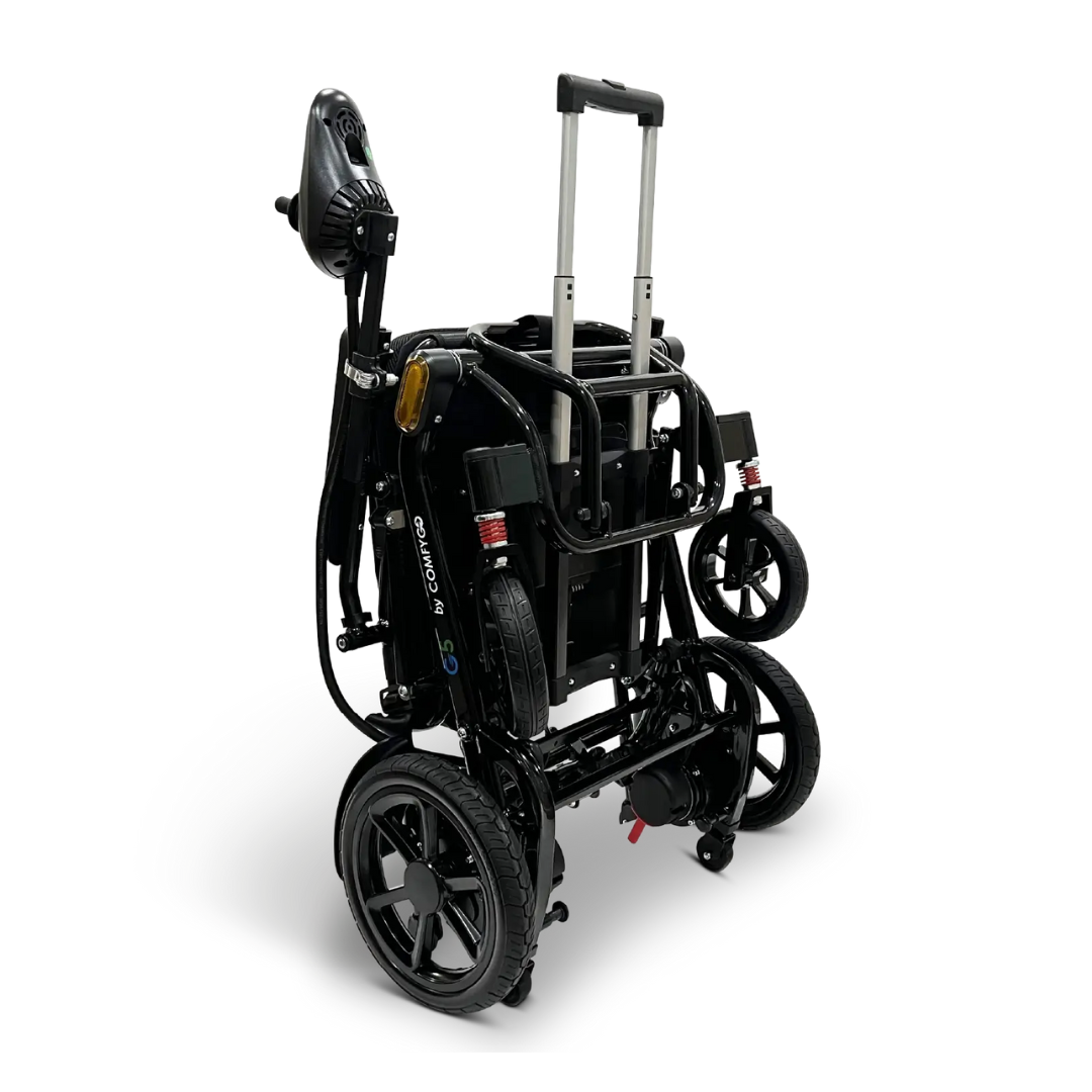 The Glide Care G-5 PRO Lightweight Foldable Electric Wheelchair is shown folded upright, highlighting its compact design with large rear wheels, small front wheels, handlebars, and a stowed seat—perfect for travel.