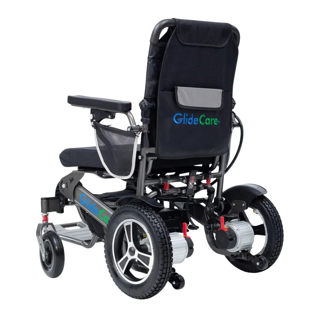 The Glide Care G-6 Lightweight Foldable Electric Wheelchair, shown from a rear angle, features large rear wheels, small front wheels, armrests, a mesh side pocket, and displays "GlideCare" on the backrest and frame.