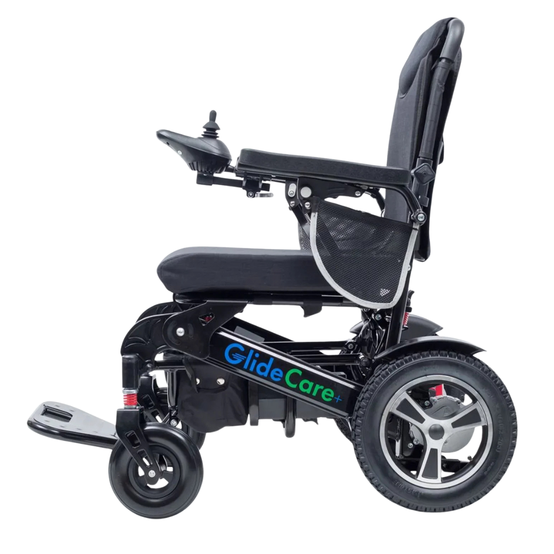 A black Glide Care G-6 Lightweight Foldable Electric Wheelchair with a joystick on the armrest, mesh side pocket, cushioned seat, and large rear wheels is shown from the side against a white background.