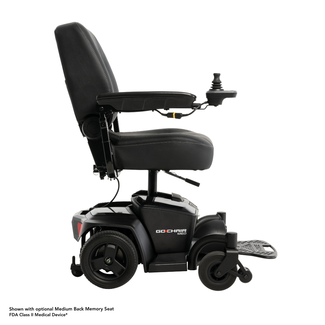The Pride Mobility Go Chair® MED Portable Powerchair in black features a medium back memory seat, right armrest joystick control, and extended footrest. This lightweight chair is shown from the side against a white background.