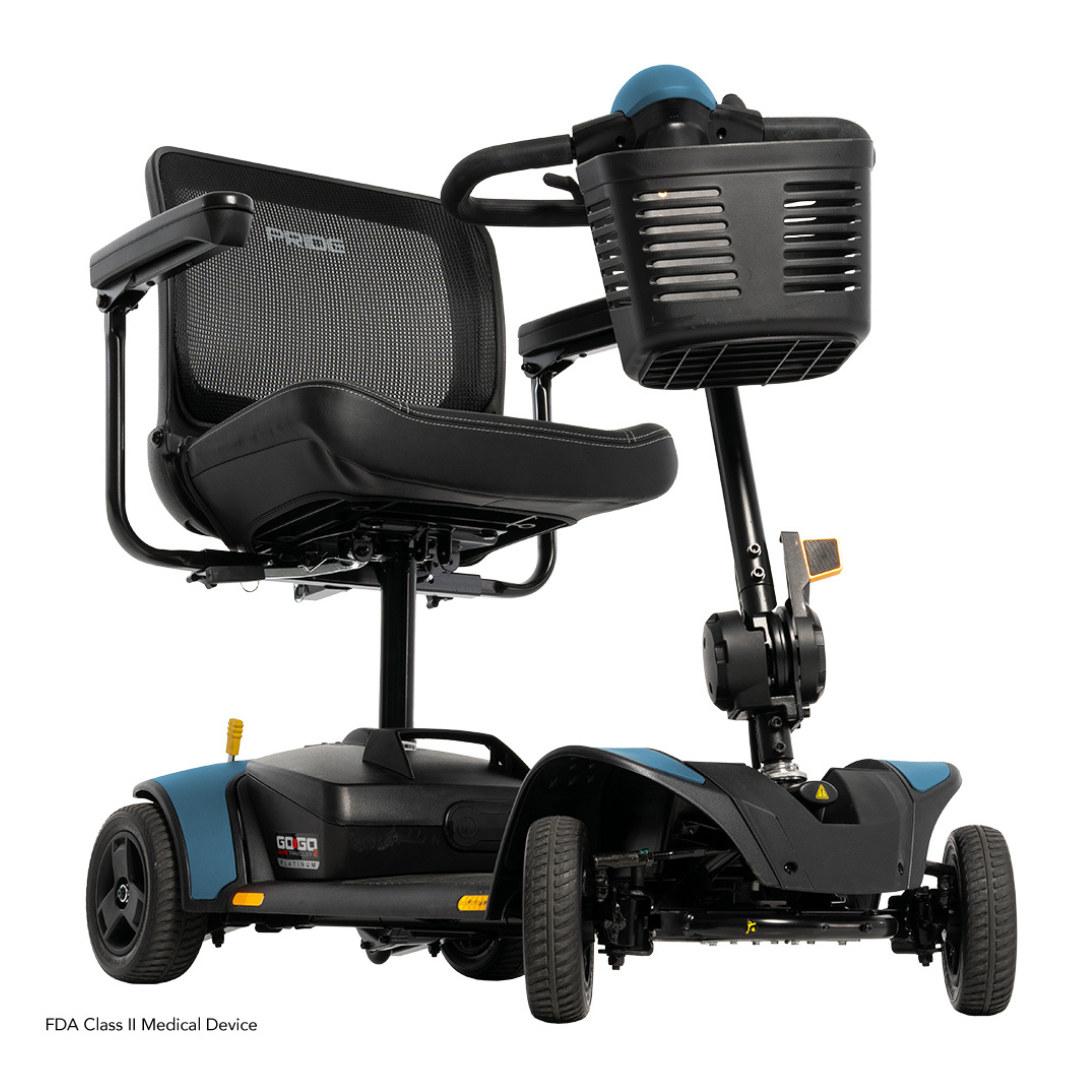 The Pride Mobility Go Go Elite Traveller® 2 Platinum Scooter, in black and blue, features a mesh backrest, armrests, front basket, and three wheels—ideal for those with mobility challenges.