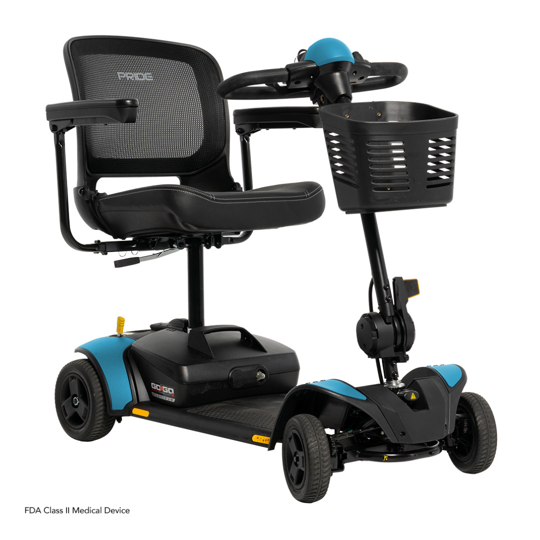 The Pride Mobility Go Go Elite Traveller® 2 Platinum Scooter features a black and blue design, mesh backrest, padded seat, armrests, front basket, and three wheels for versatile indoor and outdoor mobility.