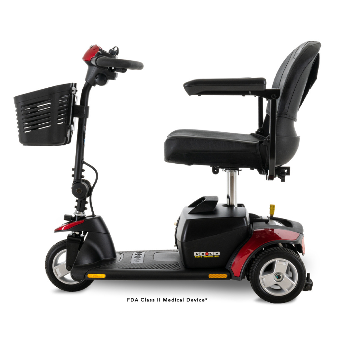 The Pride Mobility Go Go® Elite Traveller 3-Wheel Mobility Scooter is a black and red scooter with a lightweight design, featuring a steering handle, front basket, comfy seat with armrests, and easy one-handed frame separation for travel.