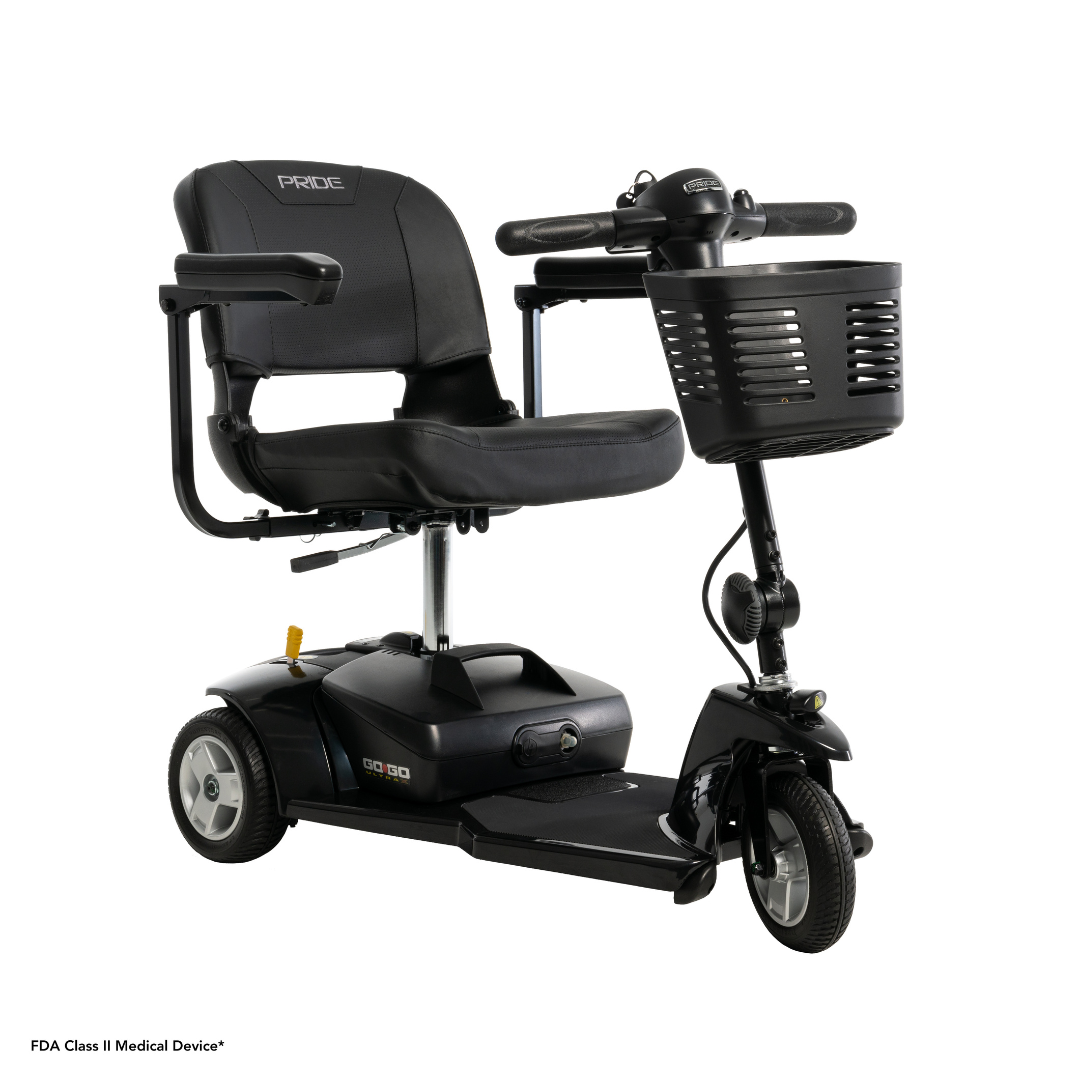 The Pride Mobility Go Go® Ultra X 3-Wheel Scooter is a black, easily portable FDA Class II Medical Device with three wheels, a padded seat with armrests, and a handy front basket. It features economy-class scooter styling and handlebars with controls.