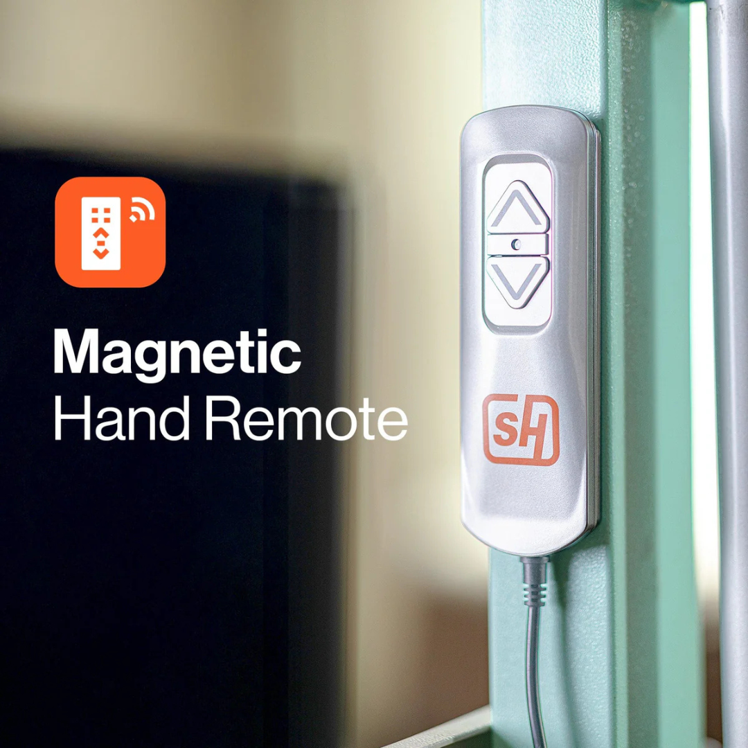 A silver magnetic hand remote for the SuperHandy GoRise FC Bariatric Electric Floor to Chair Lift, featuring up/down arrow buttons and an "SH" logo, is attached to a green metal surface. Text reads: “Magnetic Hand Remote” above a remote icon.