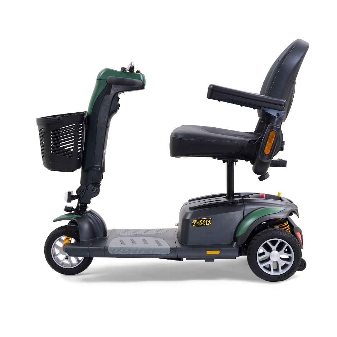A side view of the Golden Buzzaround LX GB119 - Heavy Duty 3 Wheel Portable Mobility Scooter showcases a luxury mobility scooter equipped with three wheels, a front basket, and a plush seat. This black scooter with green highlights includes armrests on the seat, textured footrests on its base, and visible rear wheel suspension.