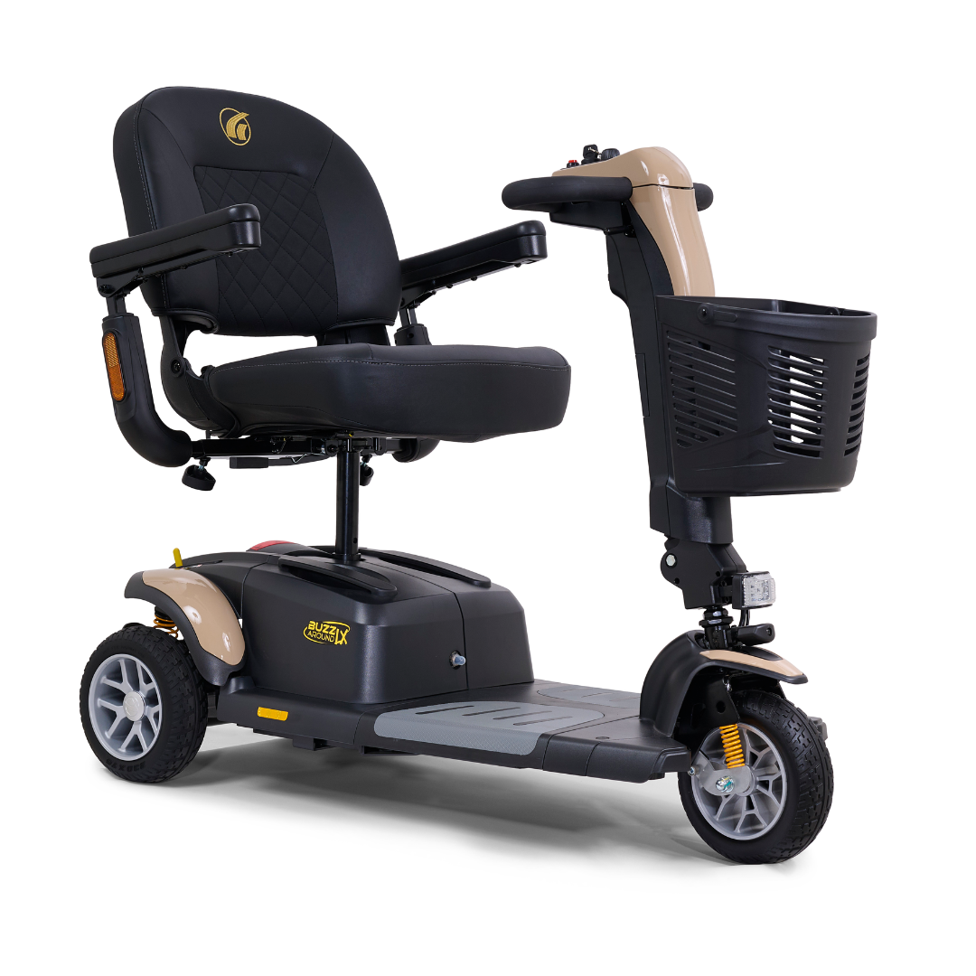 Introducing the exceptional Golden Buzzaround LX GB119, a heavy-duty three-wheel portable mobility scooter by Golden Technologies. This compact marvel features a cushioned seat, armrests, and a front basket. Primarily designed in black with beige accents, it boasts small headlights for an elegant touch.