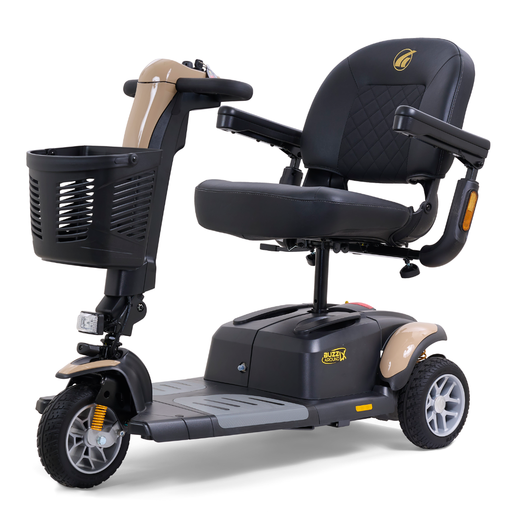The Golden Buzzaround LX GB119 is a heavy-duty, three-wheel portable mobility scooter that features a black seat and armrests. It comes equipped with a front storage basket, padded backrest, and rubber tires to ensure easy maneuverability and exceptional comfort.