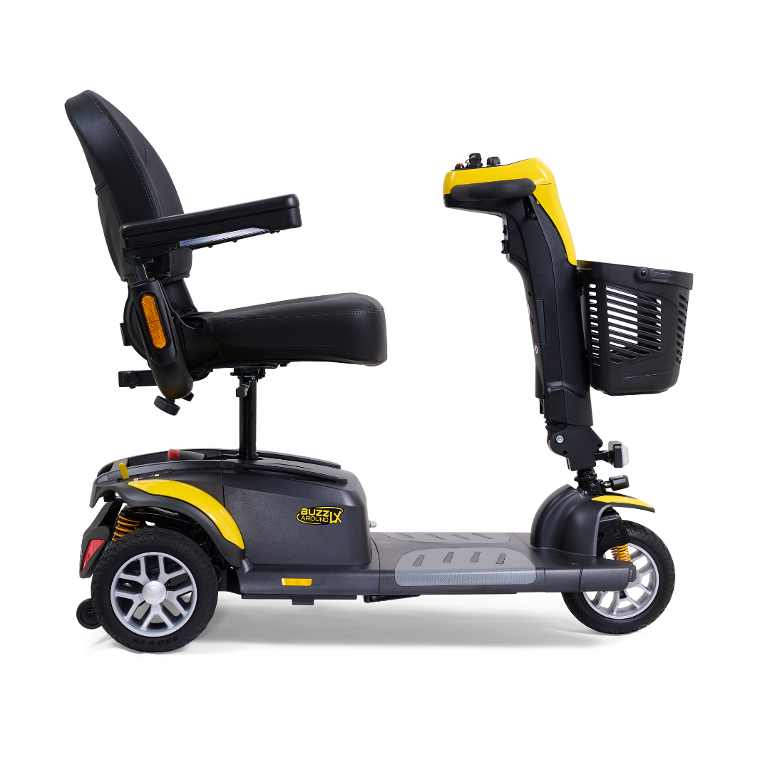 Side view of a black and yellow Golden Buzzaround LX GB119 luxury mobility scooter, featuring a padded seat, backrest, and armrests. This heavy-duty three-wheel model from Golden Technologies comes equipped with a front storage basket for convenience, making it an ideal portable mobility option.