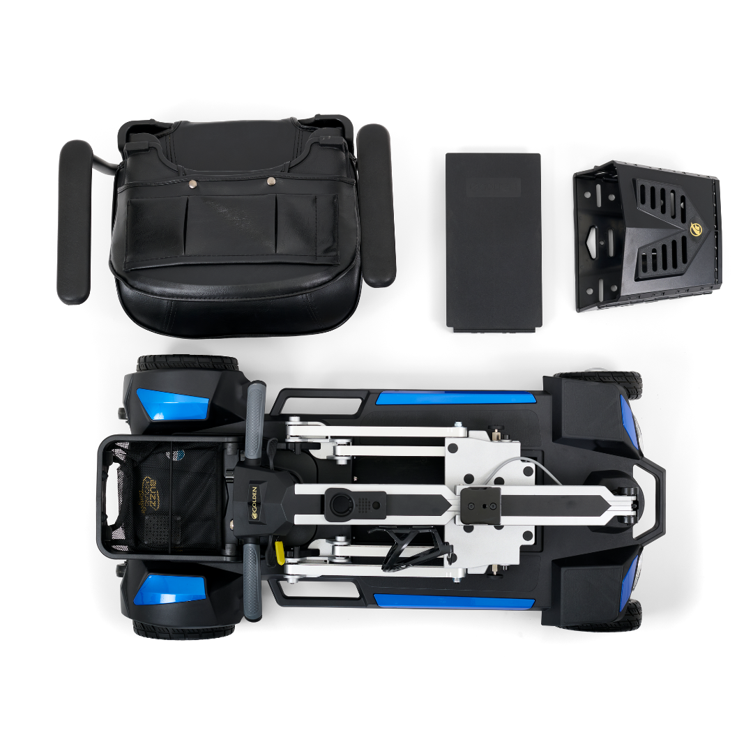Bird's-eye view of a disassembled Golden Technologies Portable Buzzaround GB120 Carry-On Travel Scooter, featuring a detachable lithium-ion battery, footrest, and cushioned seat back. The components are arranged neatly on a white background, highlighting its ultra-portable design.