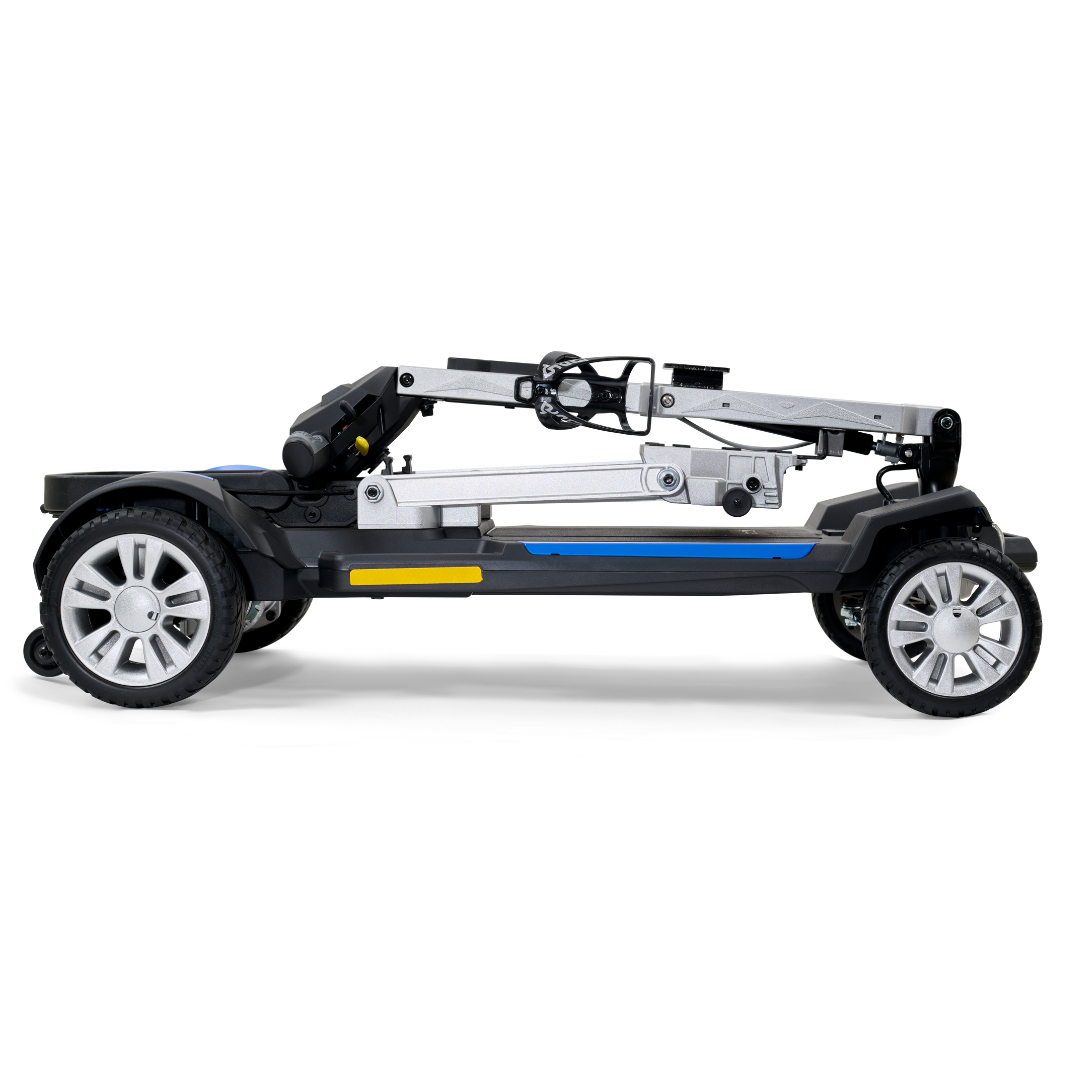 Introducing the ultra-portable Golden Technologies Portable Buzzaround GB120 Carry-On Travel Scooter, featuring an elegant fold-flat design in silver and black with visible wheels. Its sleek and compact build is enhanced by a powerful lithium-ion battery, making it perfect for easy storage and transport.