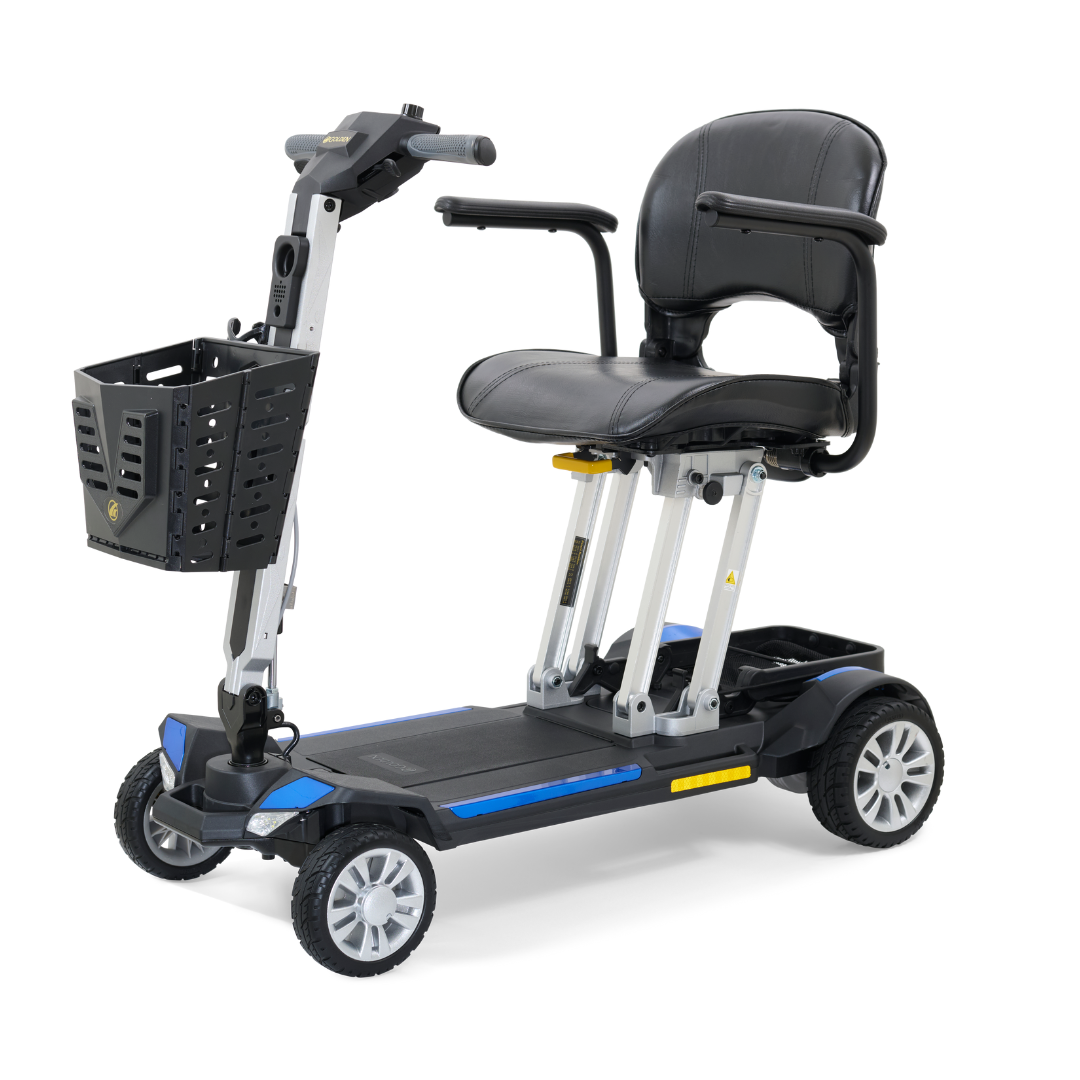 Presenting the Golden Technologies Portable Buzzaround GB120 Carry-On Travel Scooter, an ultra-portable, fold-flat scooter featuring a sleek black leather seat with armrests and four wheels. It boasts a front basket for storage and a handlebar control system, designed for easy transportation and powered by a lithium-ion battery to enhance mobility assistance.