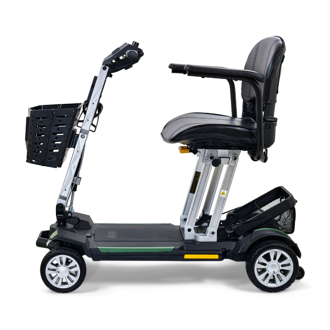 The Golden Technologies Portable Buzzaround GB120 Carry-On Travel Scooter is a sleek, black mobility scooter equipped with a cushioned seat, armrests, and a front basket. This ultra-portable model boasts four wheels and a fold-flat design for convenient transport, powered by a reliable lithium-ion battery.