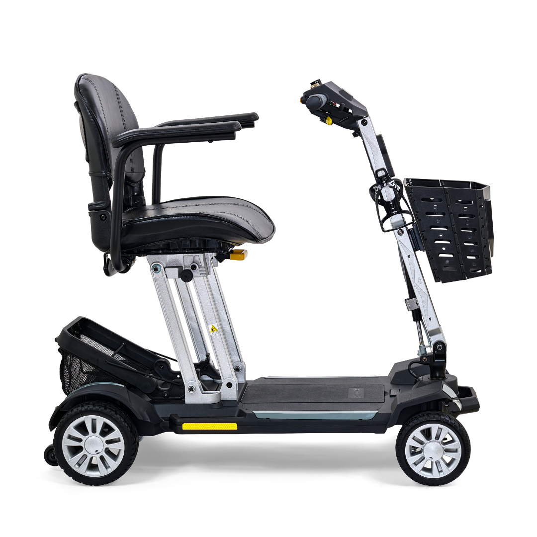 The Golden Technologies Portable Buzzaround GB120 Carry-On Travel Scooter is a black, four-wheeled mobility scooter featuring a padded seat, armrests, and a front basket. Designed for ultra-portability, this scooter has a foldable frame and is powered by a lithium-ion battery, making it compact and perfect for easy transport.