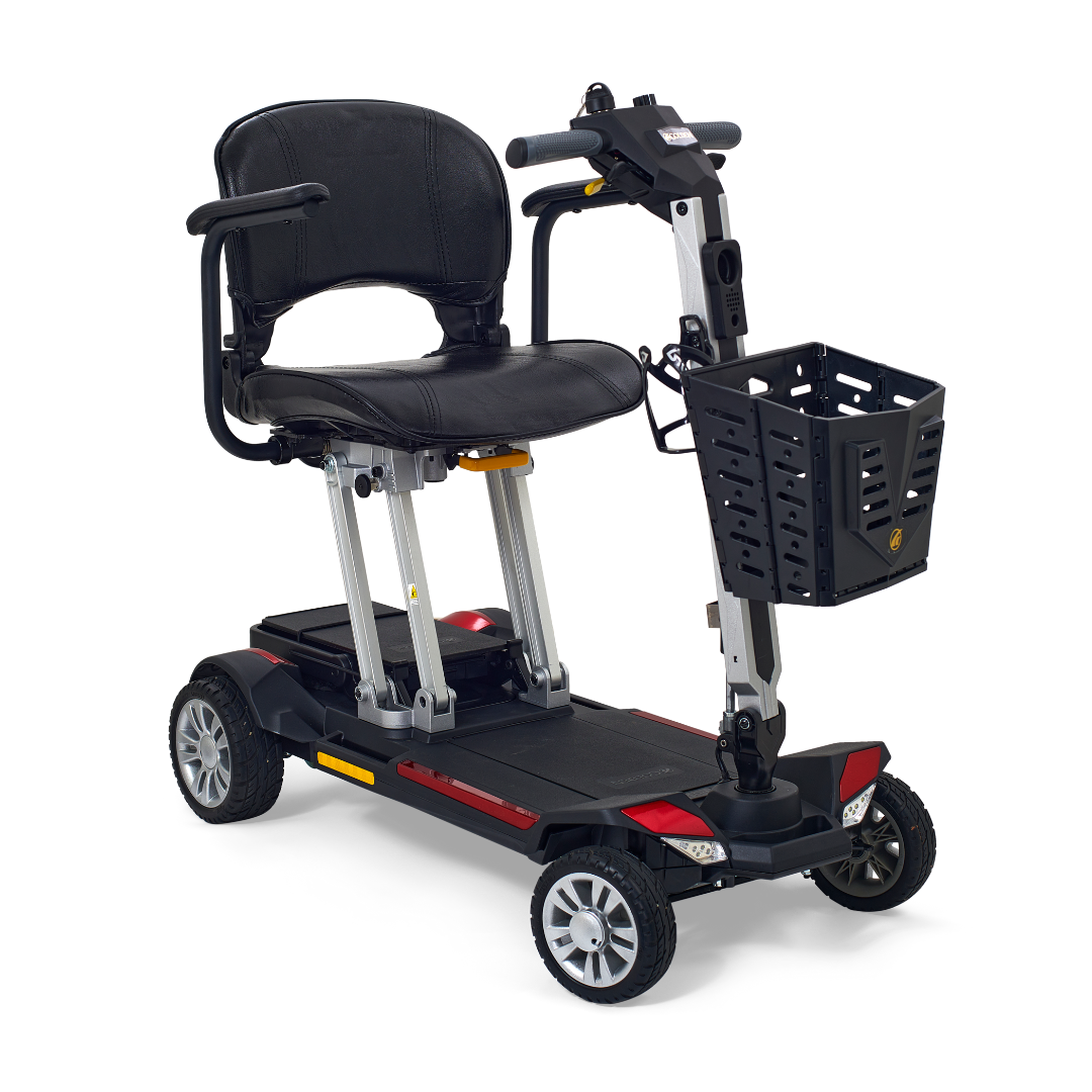 The Golden Technologies Portable Buzzaround GB120 Carry-On Travel Scooter features a fold-flat design with a black seat, armrests, and control handle. It has four wheels and includes a front basket for added convenience, making it ultra-portable for easy transportation and maneuverability. This scooter is powered by an efficient lithium-ion battery.