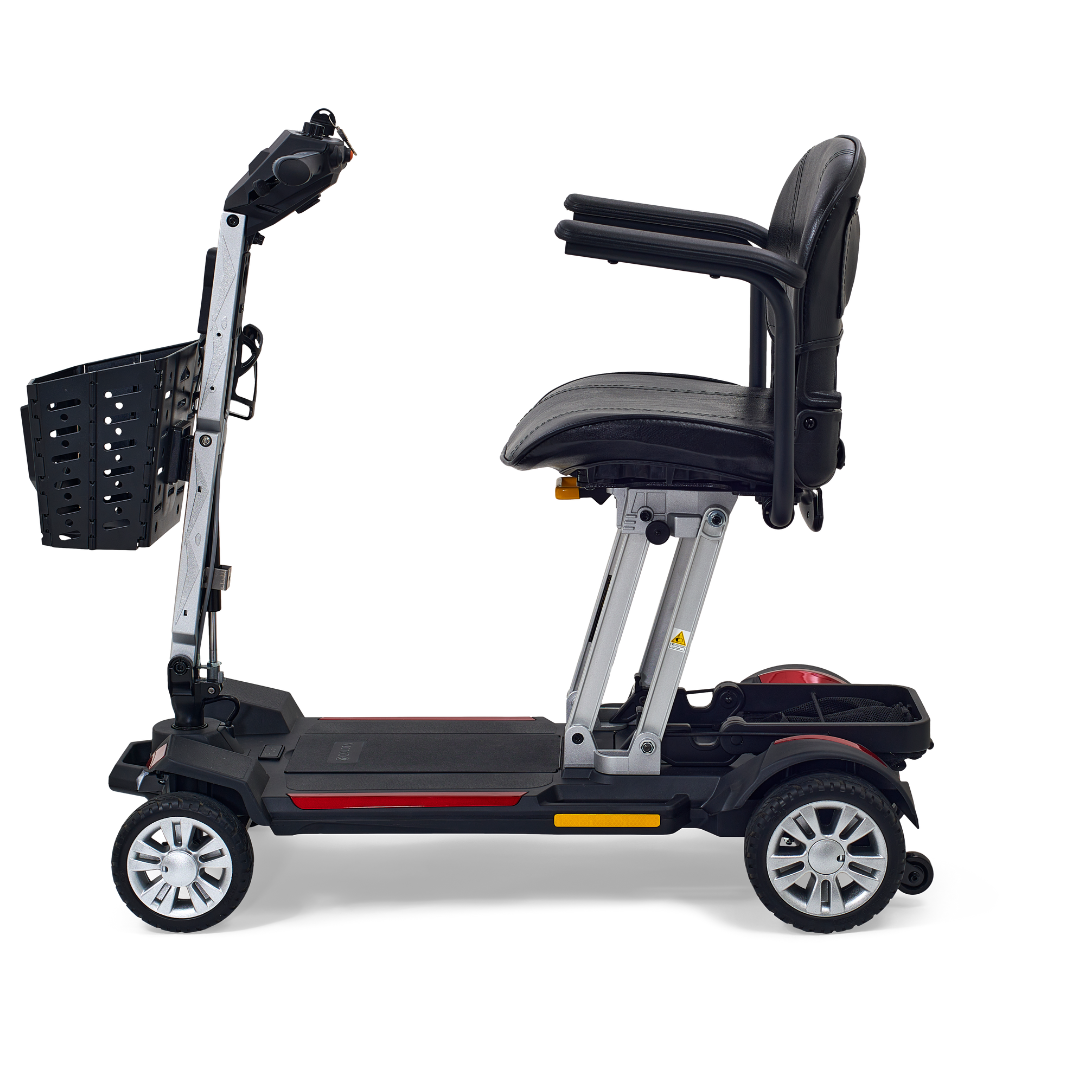The Golden Technologies Portable Buzzaround GB120 Carry-On Travel Scooter showcases a side view against a white background, featuring a black seat, armrests, and a small front basket. This fold-flat scooter is equipped with four wheels and a modern lithium-ion battery for easy portability.