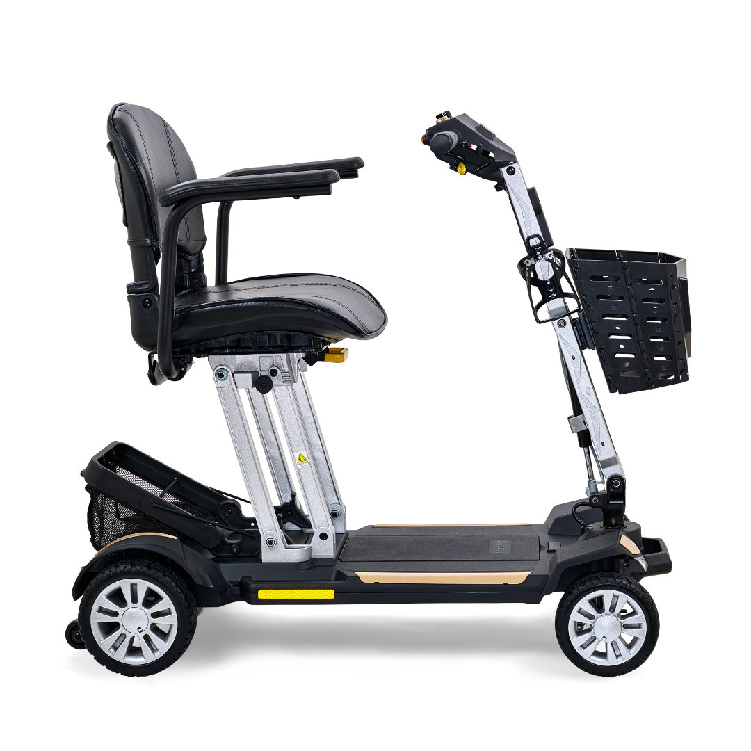 Side view of the Golden Technologies Portable Buzzaround GB120 Carry-On Travel Scooter, a black mobility scooter featuring a comfortable seat, armrests, and a front basket. This ultra-portable design is compact with four wheels for stability and includes a fold-flat option powered by a reliable lithium-ion battery for added convenience.