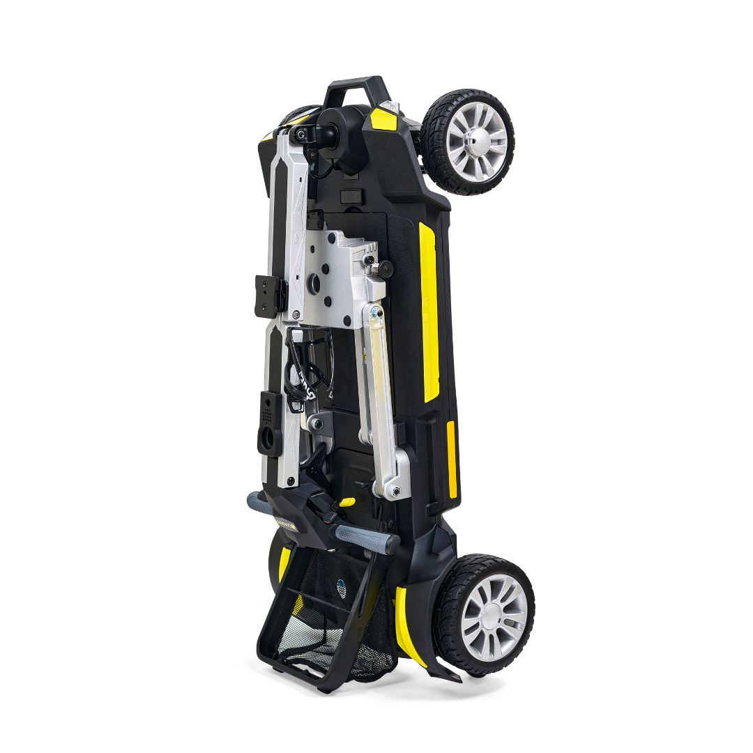 Standing upright on its back wheels, the Golden Technologies Portable Buzzaround GB120 Carry-On Travel Scooter features a foldable yellow and black design. This ultra-portable scooter is compact, boasting durable metallic components and a sturdy build. Its two rear wheels are clearly visible, emphasizing its readiness for storage or transport.