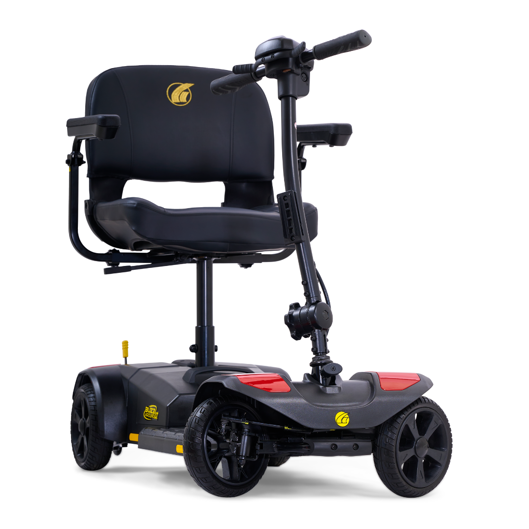 The Golden Tech GB108 Buzzaround LT is a compact black 4-wheel mobility scooter with yellow and red accents, a lightweight stadium-style seat with armrests, and simple handlebar controls, designed for both indoor and outdoor use.
