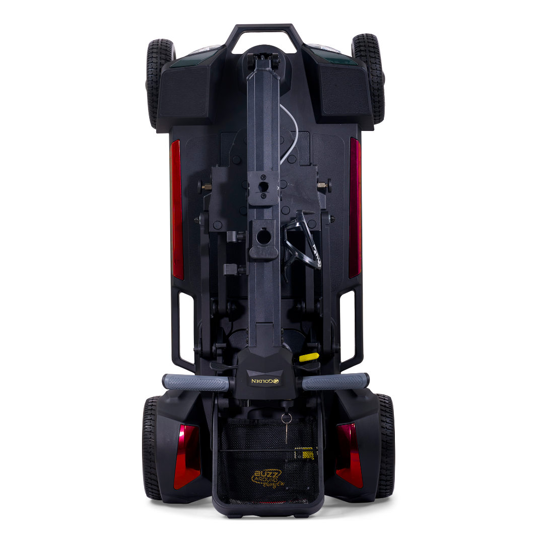 The Golden Buzzaround GB220 CarryOn HD Travel Scooter is shown folded upright from the rear, displaying its wheels, rear lights, and folded seat to highlight its compact, portable design and impressive 400 lb weight capacity.