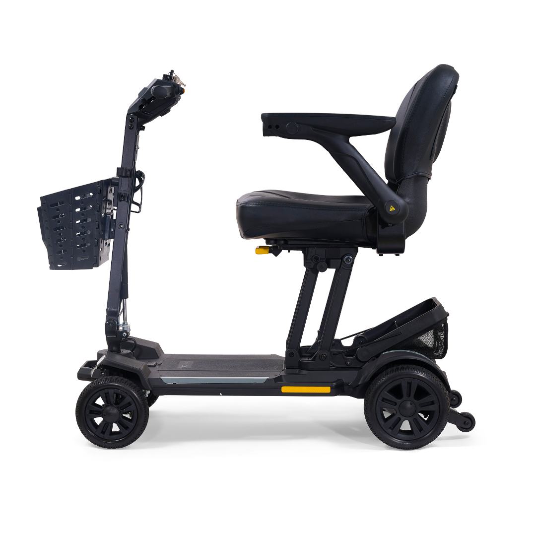 The Golden Buzzaround GB220 CarryOn HD Travel Scooter, shown in black with a padded seat, armrests, four wheels, front basket, and handlebar control panel, is viewed from the side against a white background.