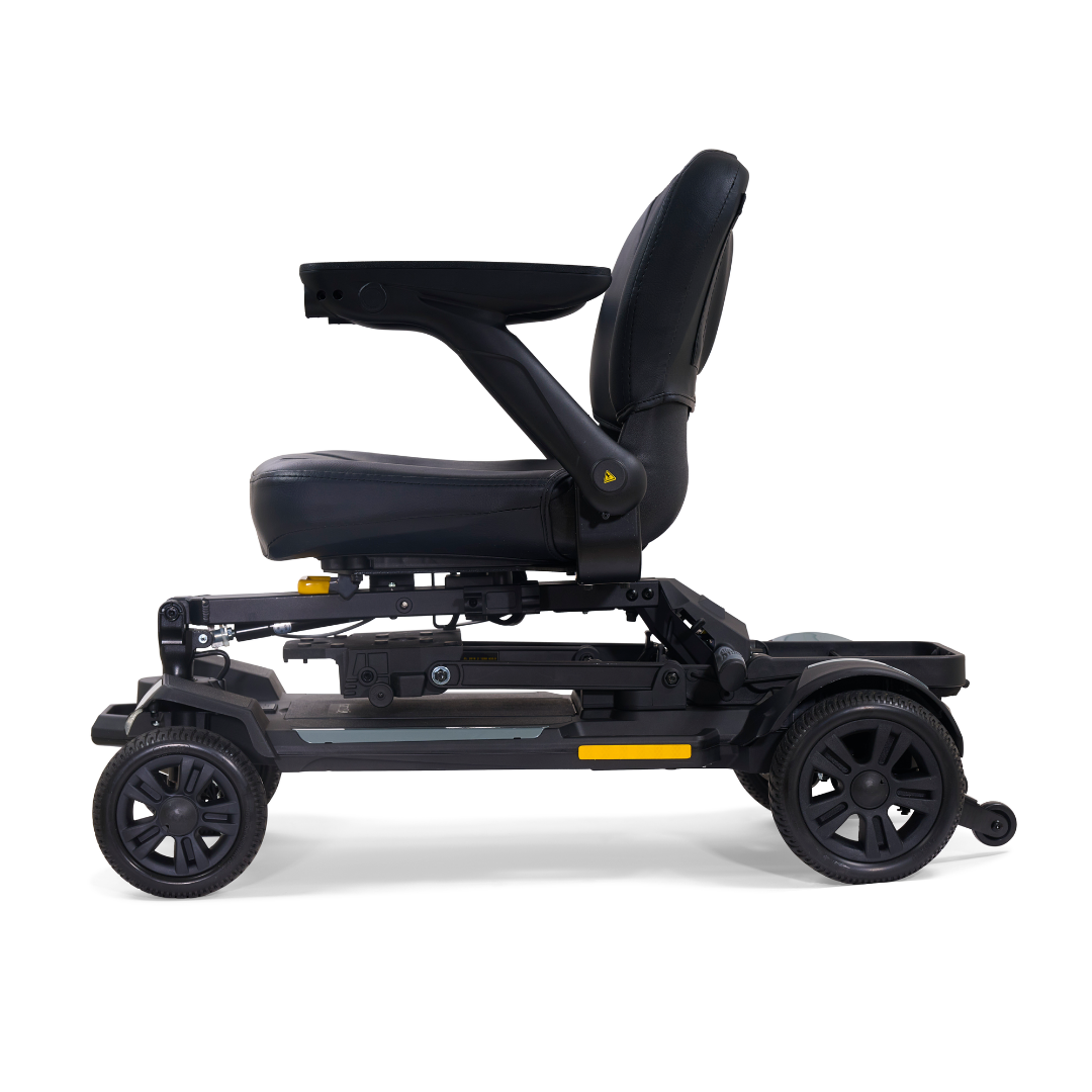 A side view of the Golden Buzzaround GB220 CarryOn HD Travel Scooter, a black electric mobility scooter with padded seat, armrests, four wheels, modern compact design, and a 400 lb. weight capacity.