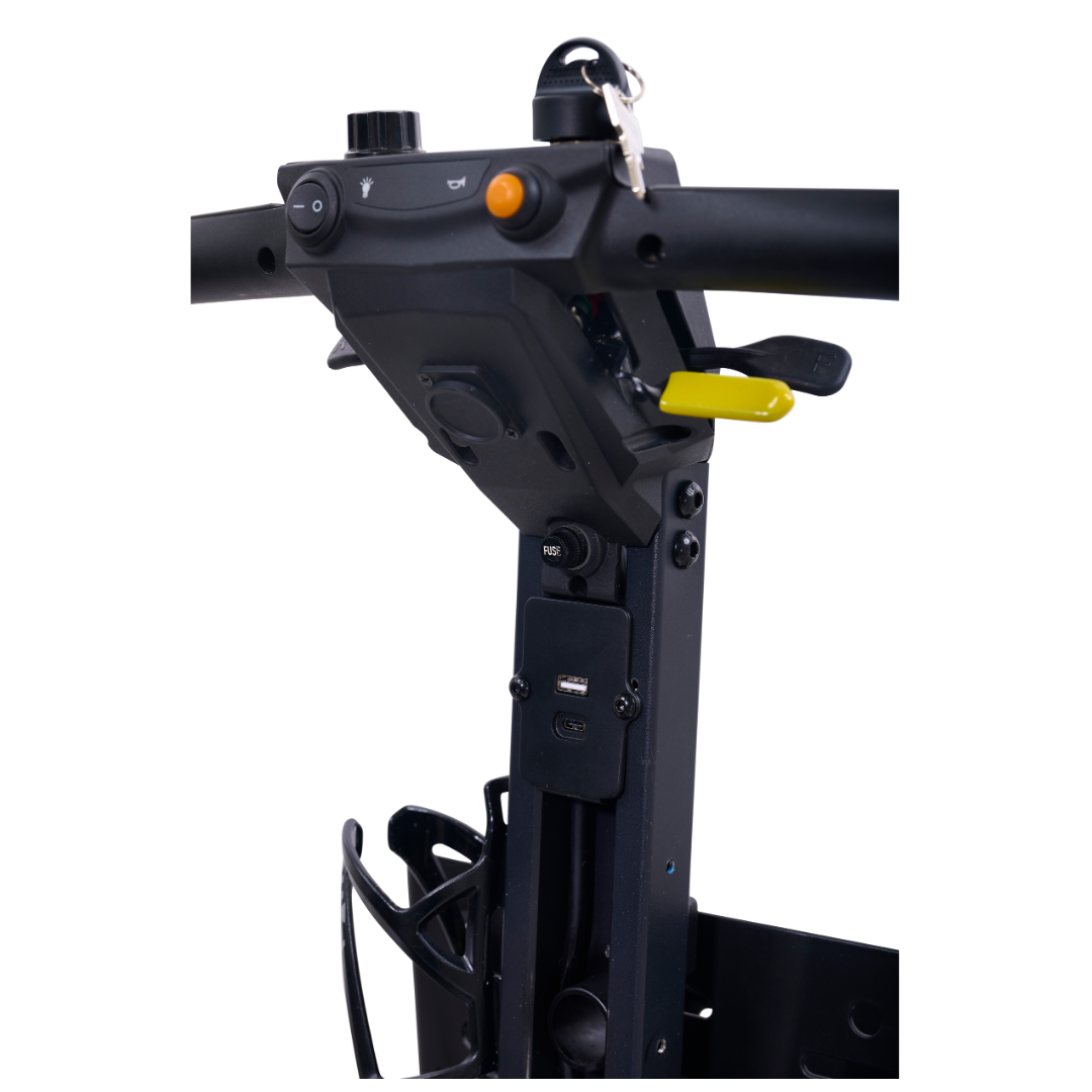 Close-up of the Golden Buzzaround GB220 CarryOn HD Travel Scooter’s control panel with buttons, key, and yellow lever on the handlebar. Lightweight and portable, it features a 400 lb weight capacity against a white background.