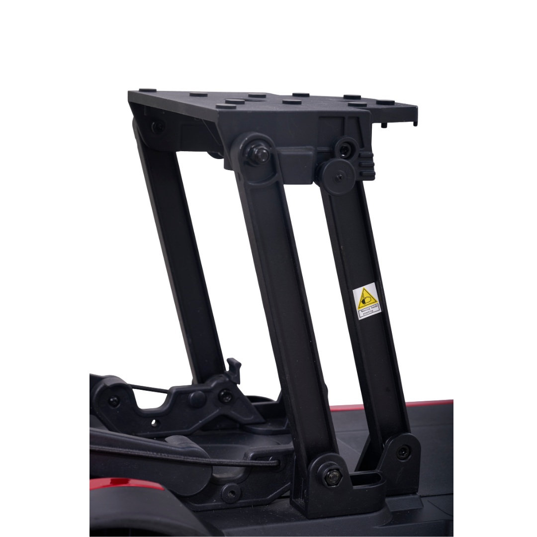 Close-up of the black folding arm with joints and a warning sticker, attached to the red Golden Buzzaround GB220 CarryOn HD Travel Scooter, isolated on a white background.