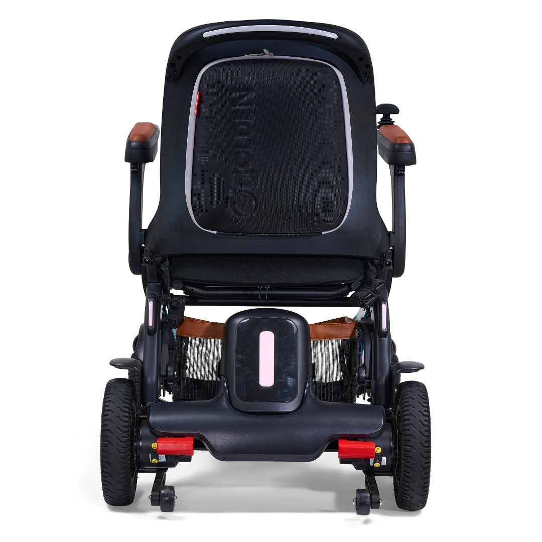 Front view of the Golden Tech Ally Pro Smart All-Terrain Power Wheelchair, featuring a sleek black frame, armrests, four omni-directional wheels, and an ergonomic black panel backrest enhanced by advanced robotics technology.