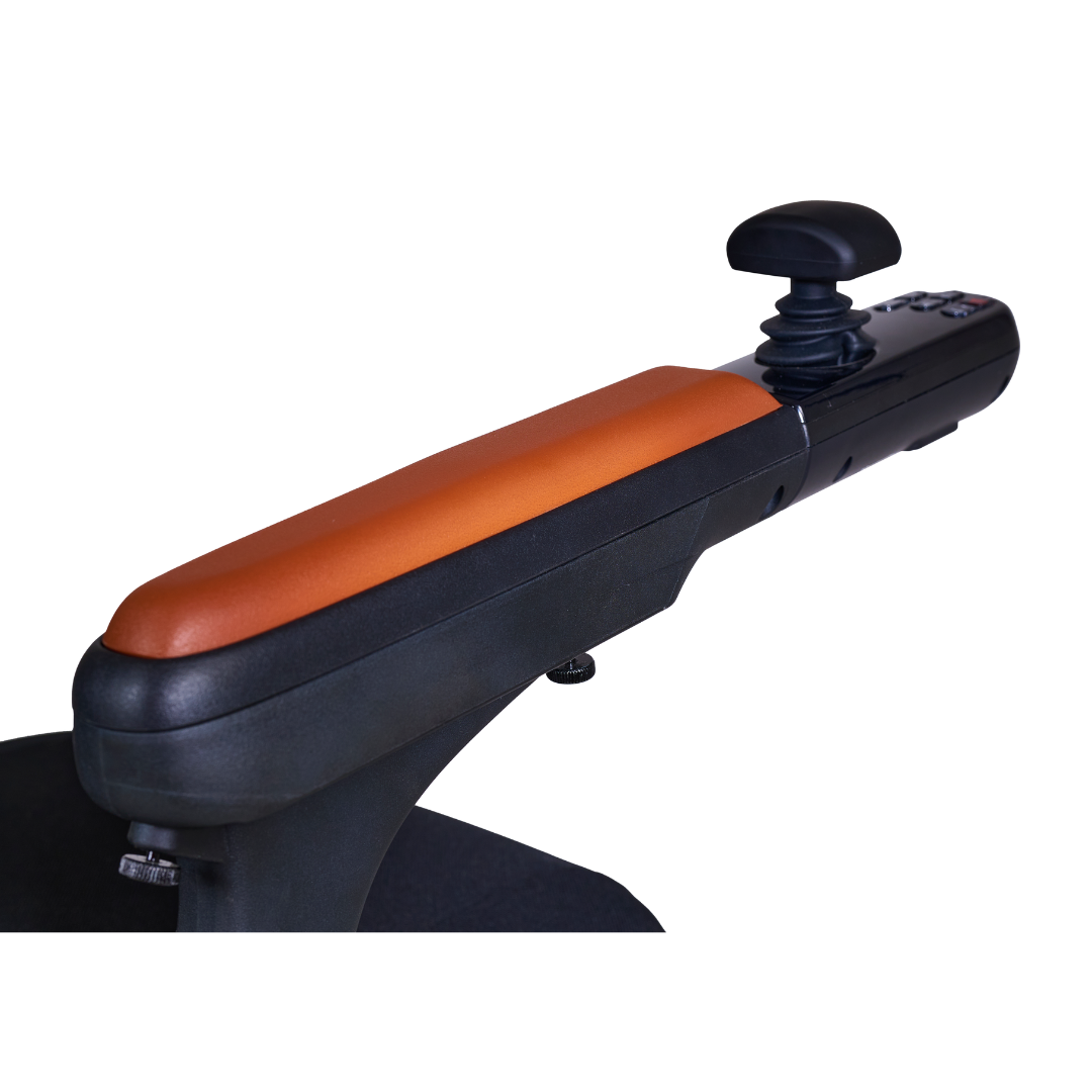 Close-up of the Golden Tech Ally Pro Wheelchairs armrest with an orange cushion and black joystick for precise control, enhanced by omni-directional wheels.