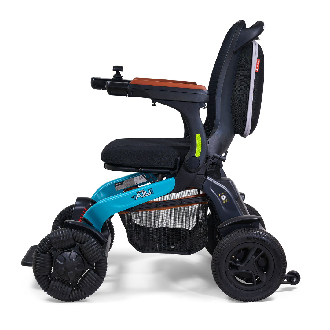The Golden Tech Ally Pro Smart All-Terrain Power Wheelchair with APP Control boasts advanced robotics technology, featuring a blue frame, black seat, and orange accents. Its large omni-directional wheels and an under-seat storage basket enhance both mobility and comfort.