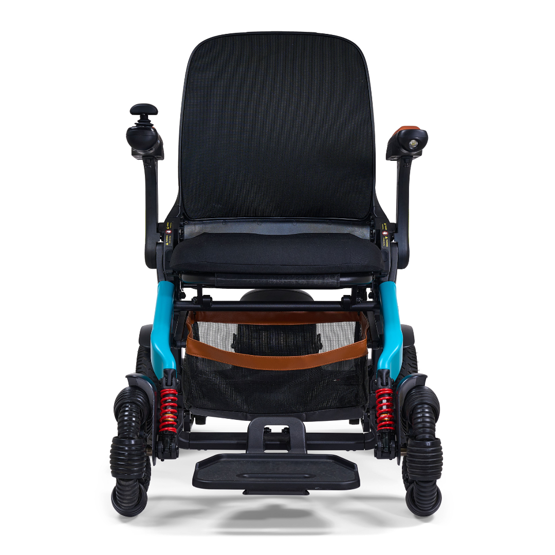 The Golden Tech Ally Pro Smart All-Terrain Power Wheelchair features omni-directional wheels, a black seat and backrest, teal frame accents, red suspension springs, a joystick on the right armrest, and a footrest at the bottom.