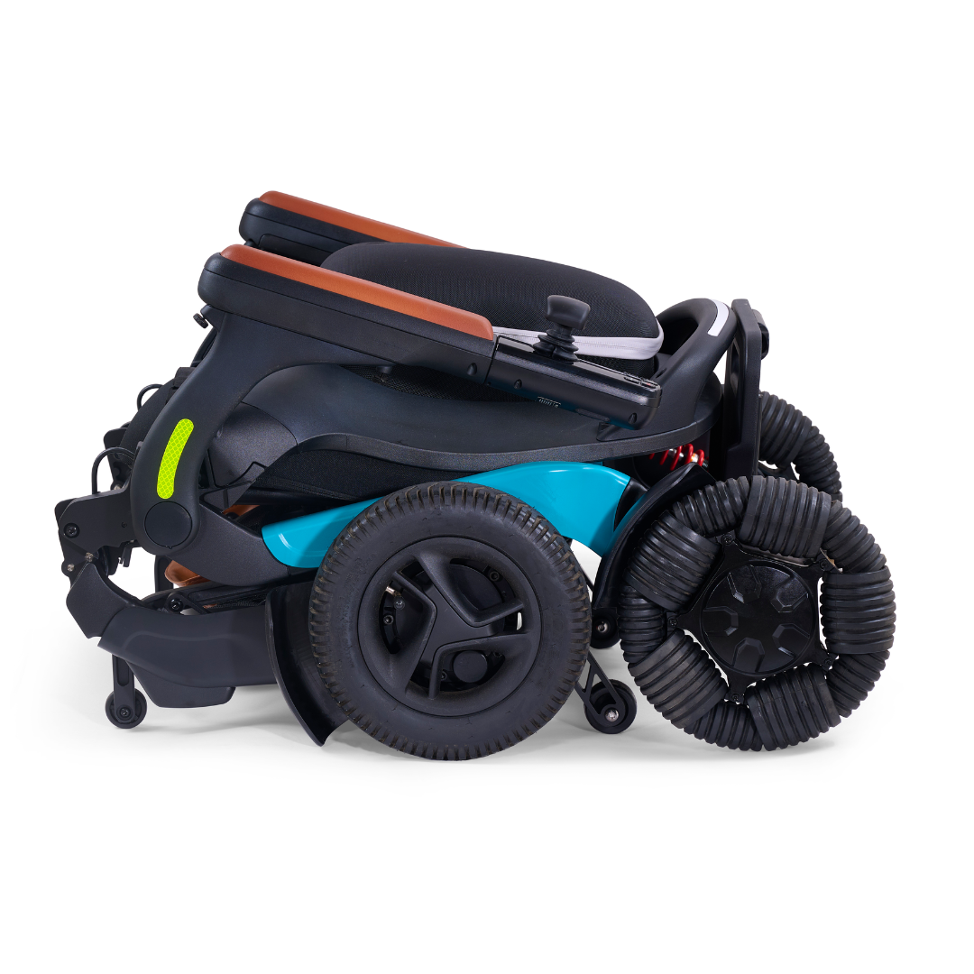 The Golden Tech Ally Pro Smart All-Terrain Power Wheelchair boasts a foldable black frame with teal blue accents and a brown cushioned seat. Its unique spiral black wheels enable effortless maneuvering.