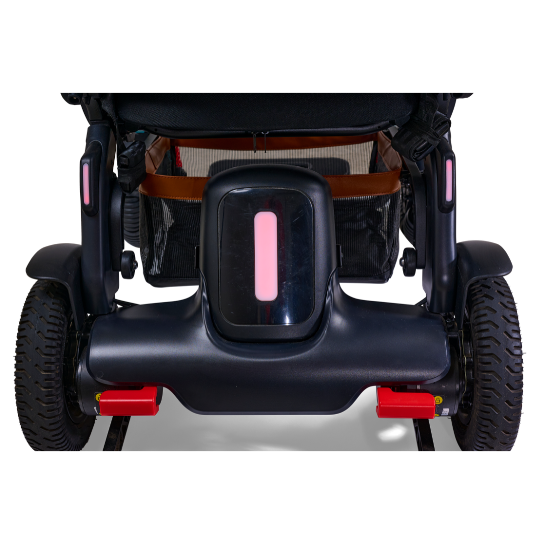 The image features the rear view of the Golden Tech Ally Pro Smart All-Terrain Power Wheelchair with omni-directional wheels, showcasing its sleek black design, red accents, and a brown storage basket under the seat, blending advanced robotics technology with style.