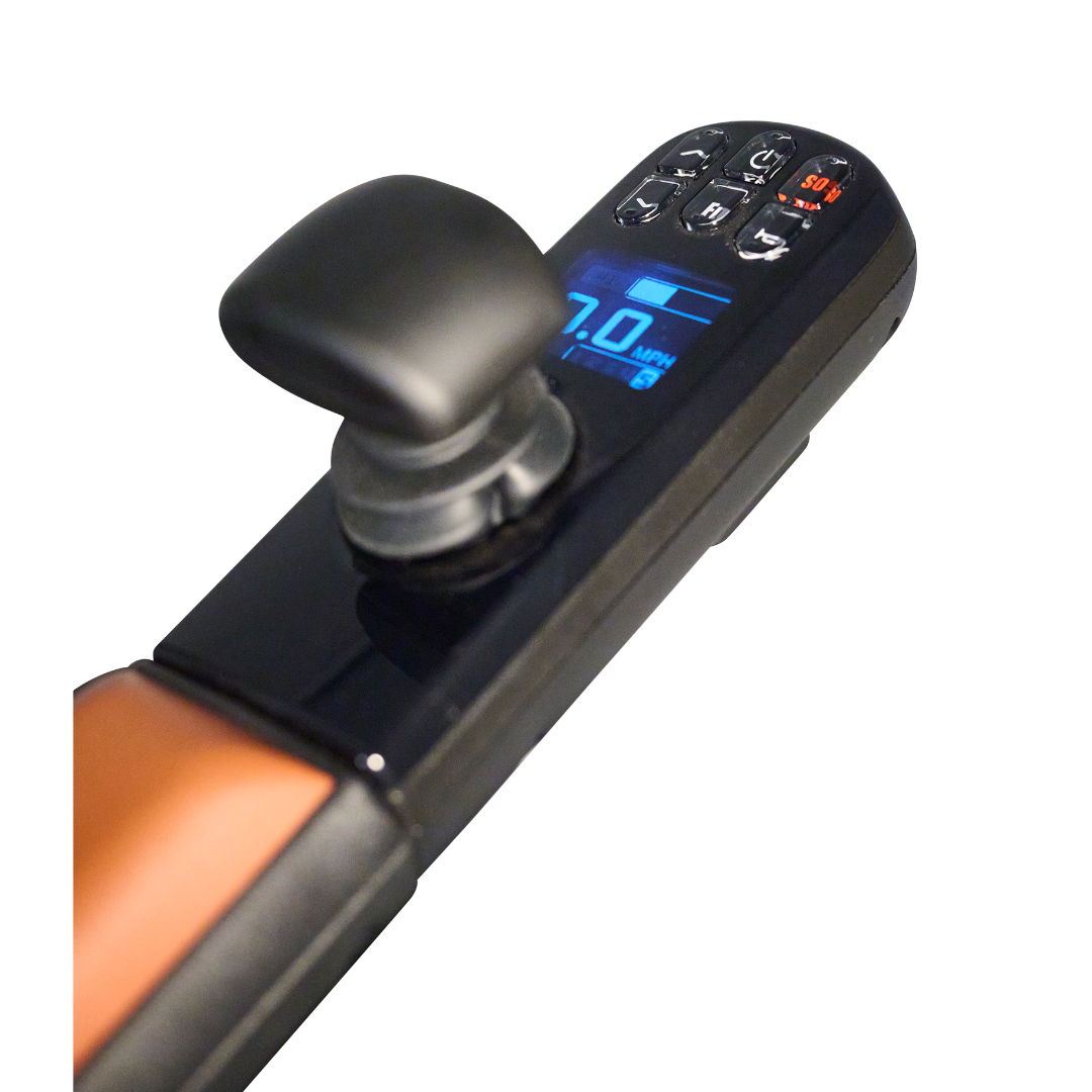 Close-up of the Golden Tech Ally Pro Smart All-Terrain Power Wheelchairs control panel showing 7.0 MPH on a blue-lit digital screen, reflecting advanced robotics technology, with buttons for speed and settings and a safety key slot. The frames black and brown colors exude modern elegance.