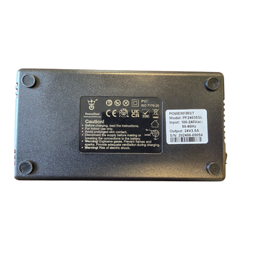 The Golden Tech 3.5 AMP Replacement Charger for scooters and power chairs is a rectangular black device with four rubber corner feet and a label showing caution instructions, technical specs, and power ratings.