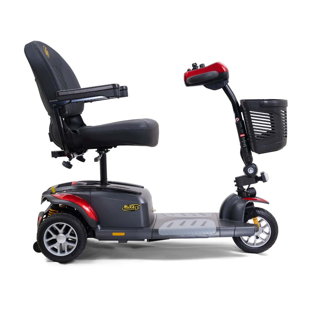 The Golden Tech GB118 Buzzaround EX Portable Mobility Scooter is a full-size, four-wheel scooter with black seating and armrests, a front black basket, striking red frame accents, and an intuitive control handlebar for effortless personal transportation.